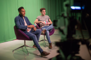 Presenters recording in a green screen studio
