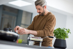 Adult male making fresh pasta