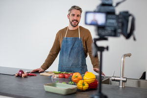 Adult male chef recording a video blog