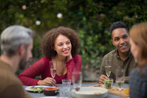 Friends eating a meal outdoors