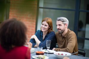 Friends eating a meal outdoors
