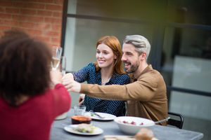 Friends eating a meal outdoors