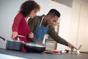 Adult male preparing using digital tablet