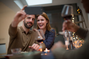Couple taking a selfie at a celebration