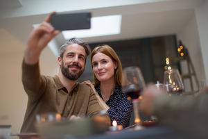 Couple taking a selfie at a celebration