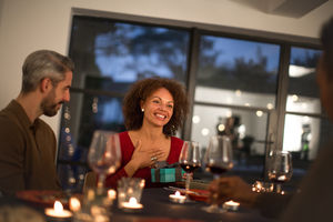 Woman being given a gift