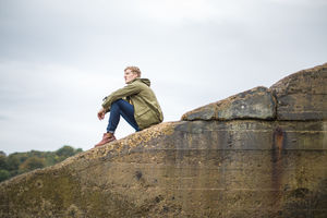 Young male thinking of future outdoors