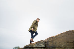 Young male walking up a steep hill