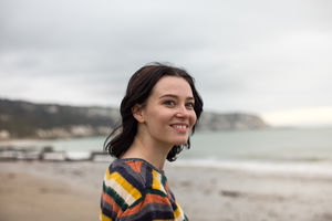 Happy young female on a winter beach break
