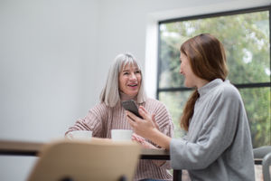 Mother and daughter catching up over coffee