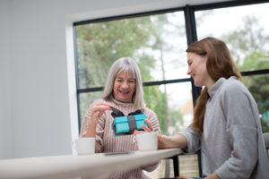 Daughter giving Mother a gift