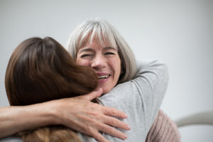 Mother and daughter hugging