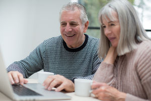 Senior couple using a laptop together