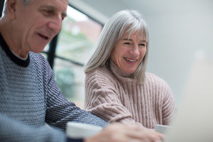 Senior couple using a laptop together