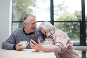 Senior couple using a smartphone together