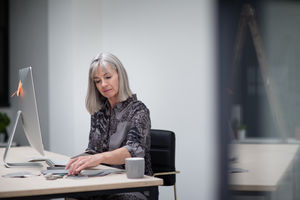Senior businesswoman working in office