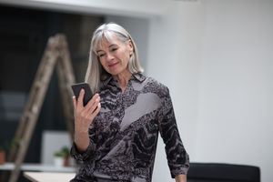 Senior businesswoman using smartphone