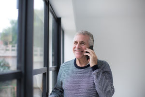 Senior man using smartphone