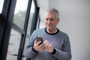 Senior man using smartphone