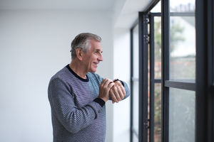 Senior man using smartwatch