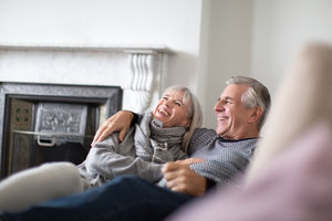 Senior couple relaxing on sofa