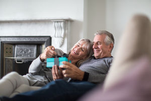 Senior couple with a gift