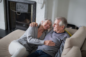 Senior couple relaxing on sofa