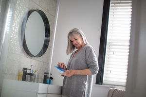 Senior woman taking medicine