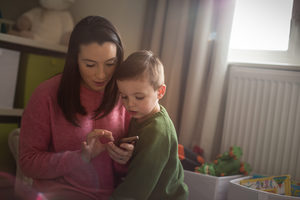 Mother and Son looking at smartphone