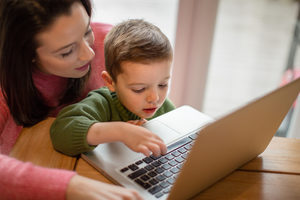 Mother and Son using laptop