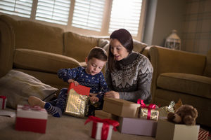 Mother and Son unwrapping Christmas gifts
