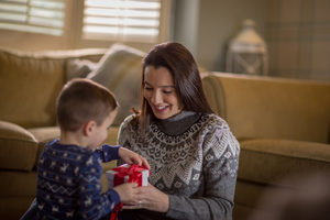 Mother and Son unwrapping Christmas gifts