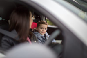 Boy smiling on car road trip