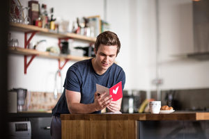 Young male reading valentines card