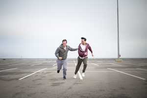 Male friends jogging outdoors