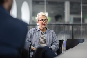 Mature businesswoman listening in a meeting