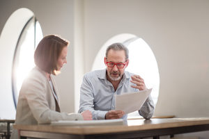 Senior man with personal finance advisor