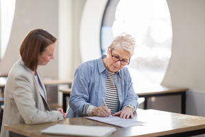 Senior woman with personal finance advisor