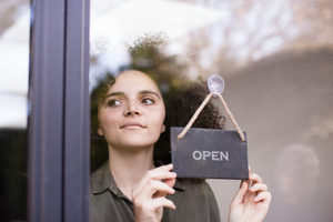 Small business owner opening store