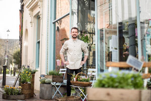 Portrait of a florist outside store