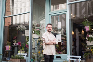Portrait of a florist outside store