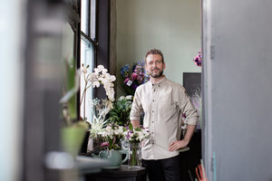 Portrait of a male florist in his store