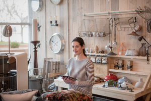 Portrait of small business owner holding digital tablet in a home store