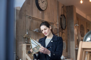 Adult female shopping in a vintage antique store