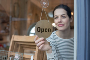 Small business owner opening store