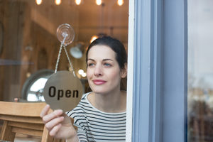 Small business owner opening store