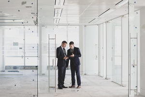 Businessmen looking at new office space