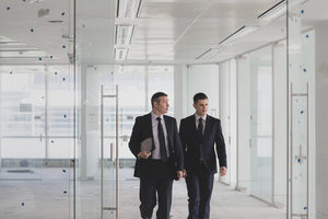 Businessmen looking at new office space