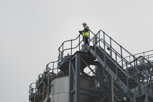 Industrial worker using a digital tablet on site