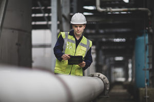 Industrial worker checking pipeline